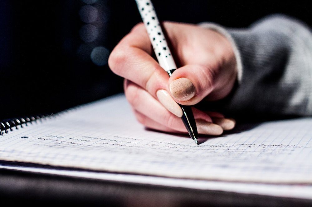 Pen writing notes on paper